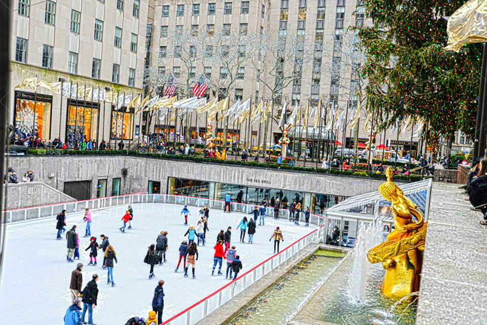 Ice skating in NYC. Skaters flock to Rockefeller Center for holiday ice skating