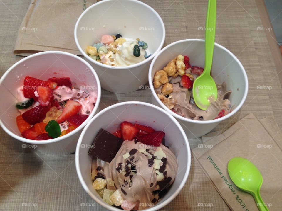 Frozen yogurt with friends. Having delicious frozen yogurt with personalized toppings with friends at qoola 

