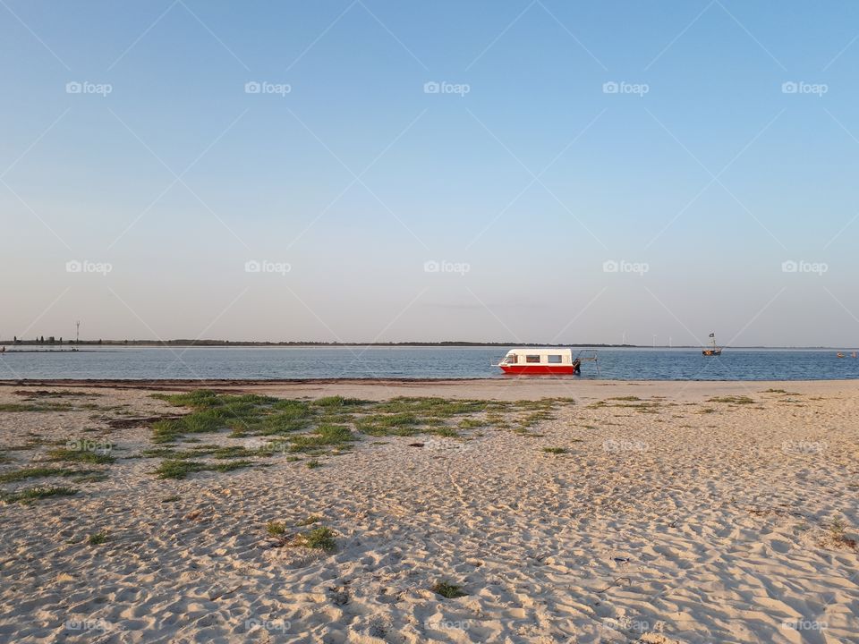 Small ship alone near the beach