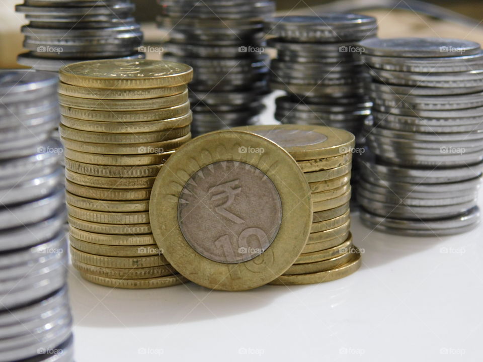 Indian Currency in Rupees - Coins are stacked with definite arrangement.