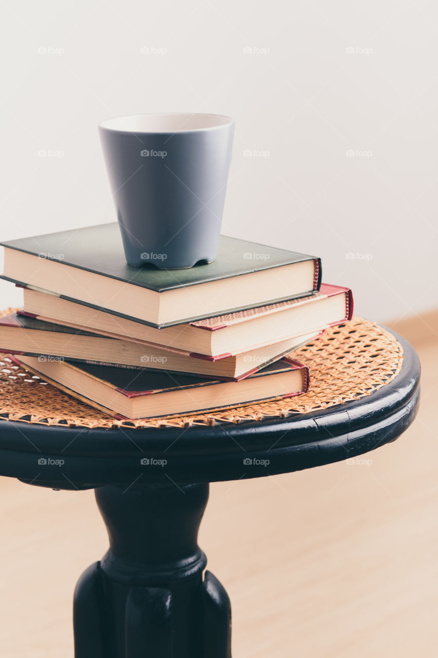 A few books with cup of coffee and cookies on wooden floor. Time for relax. Spending leisure time on reading. Cozy and comfortable. Learning from books 📖Studying for the next exam 😌