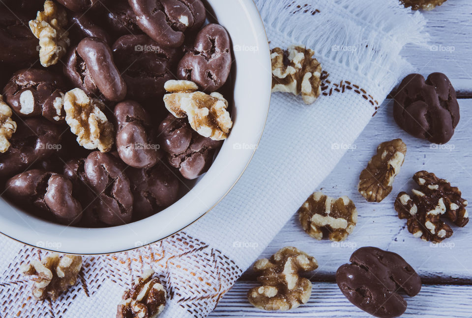 View of chocolate and nuts on table