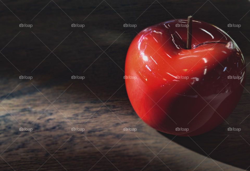 Red apple in dark light