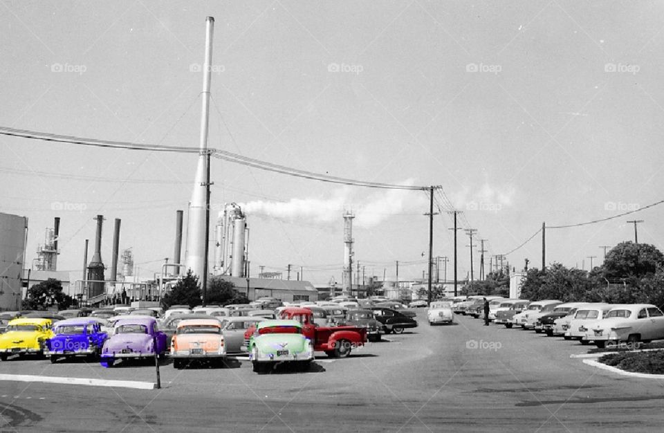 Cool picture of a work parking lot full new classic cars