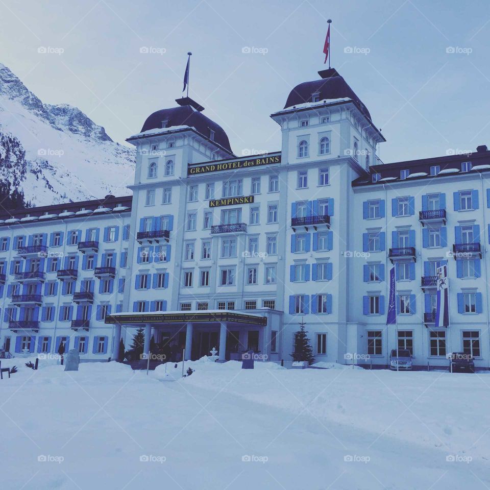 gorgeous luxury swiss resort in swiss alps st moritz Kempinski hotel in winter covered in pure white snow