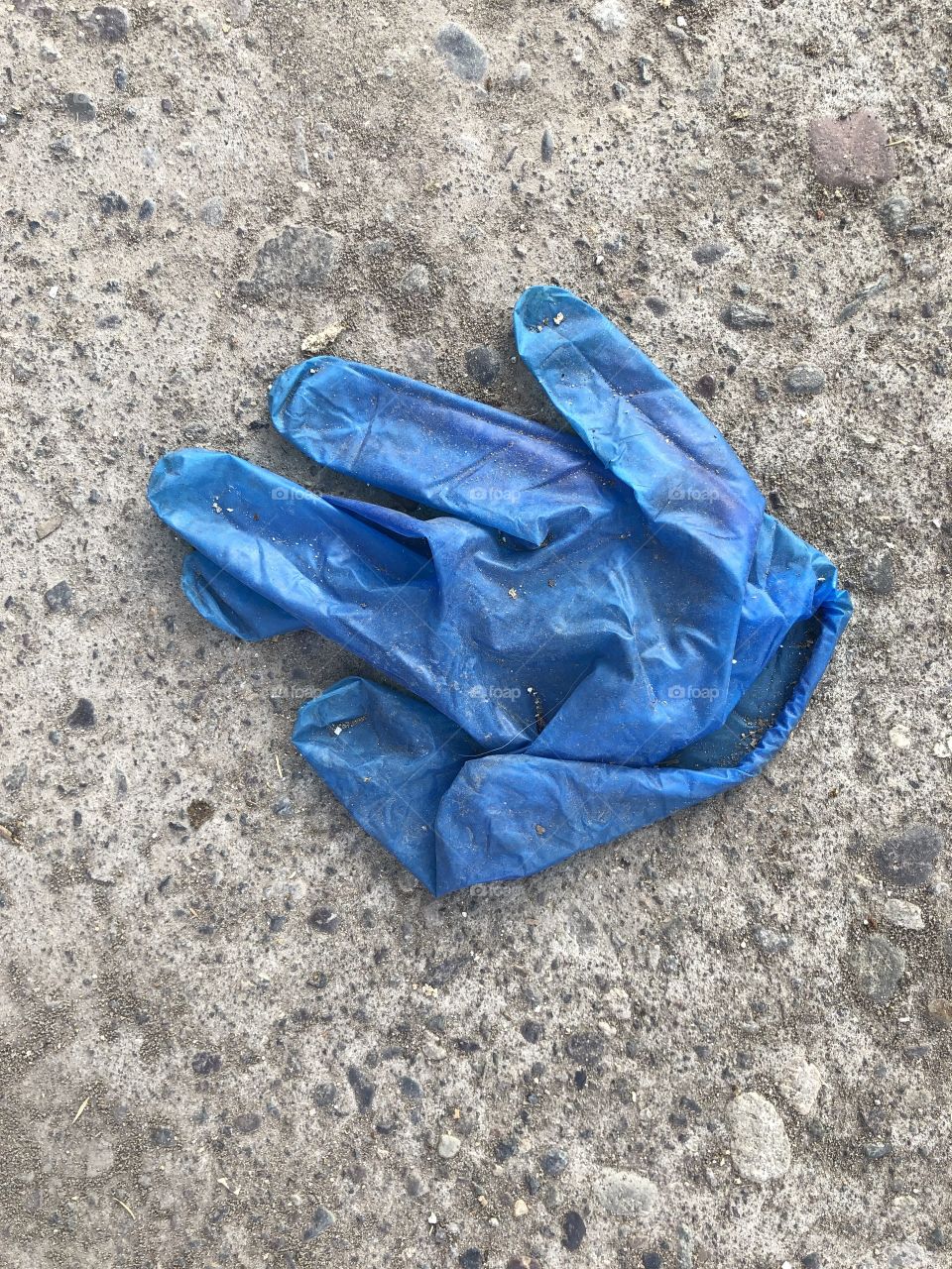 used surgical gloves discarded on the street floor, pandemic, coronavirus, human stupidity,