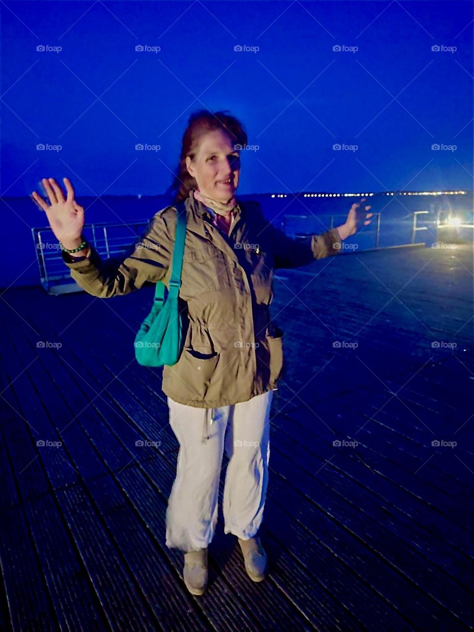 At night the beach by “Dranske” on the island “Rügen” in “Western Pomerania”, Germany is illuminated by the electric lights of surrounding houses and adjacent properties, the larger boats and of course the moon. 2024. Hypnotic Productions