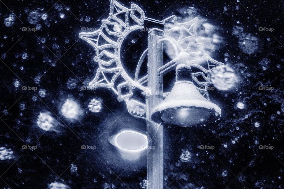 Lamp on the street during the sowing at night