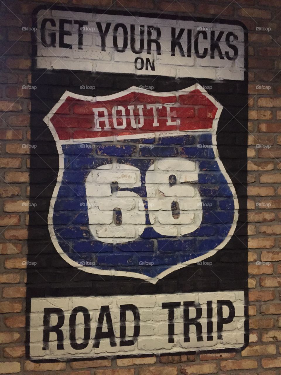 Route 66 mural on brick