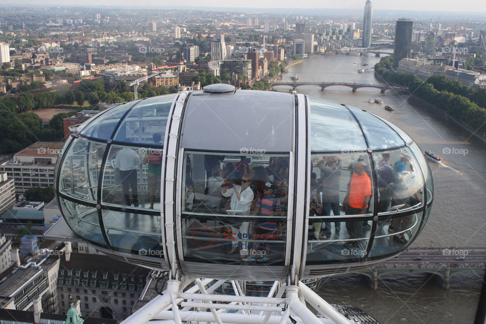 A view of people viewing the brilliant skyline in London from the London Eye