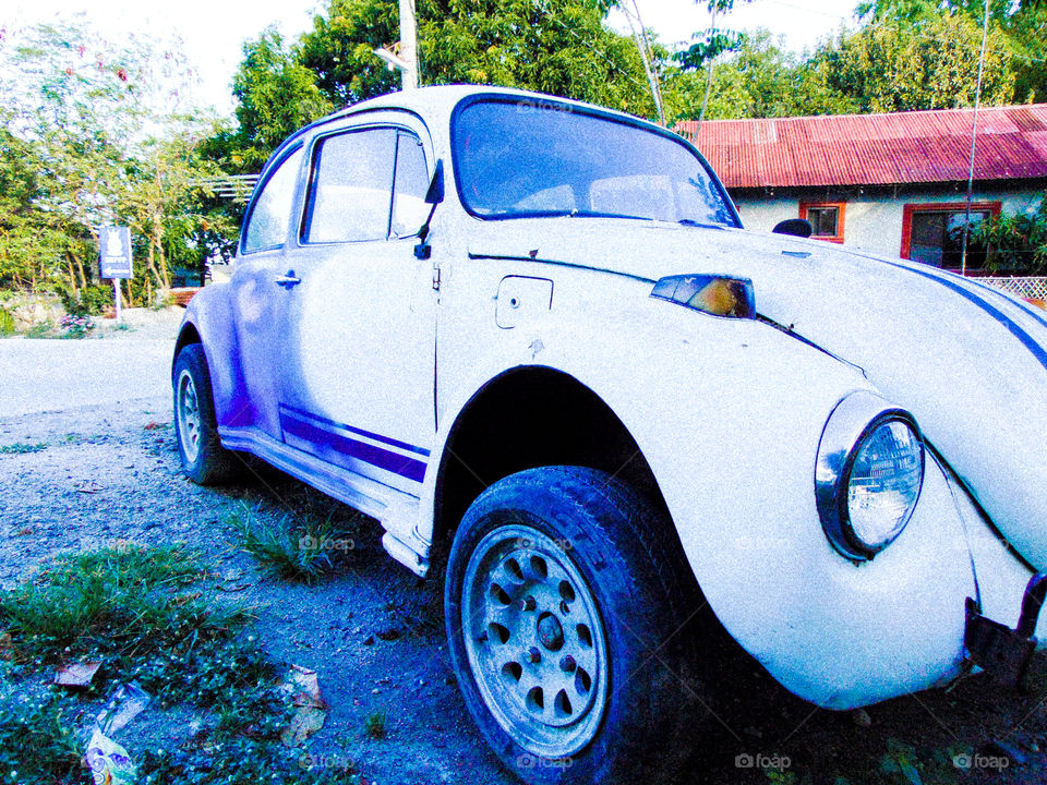 a vintage car with blue and white color