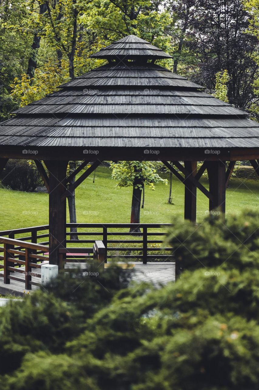 Wooden gazebo in the park