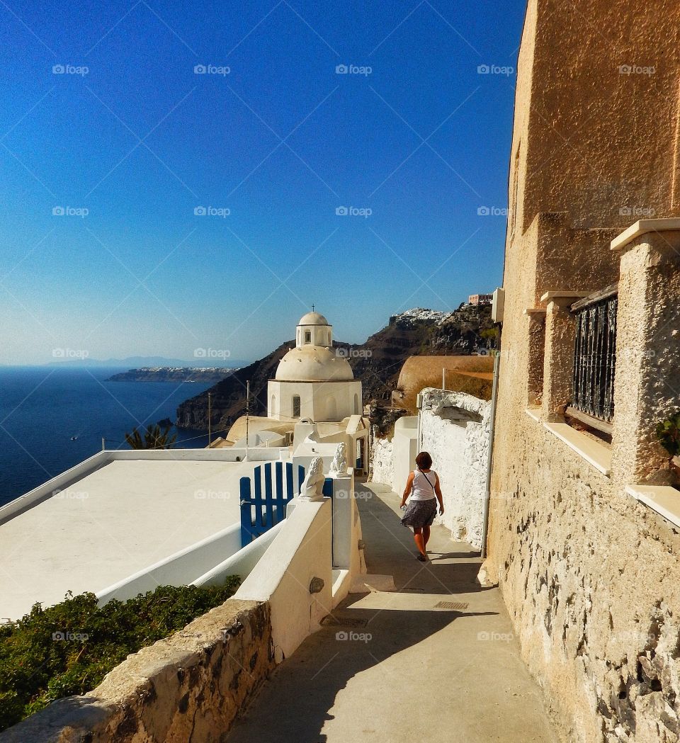 High angle view of woman walking on stairs in Santorini