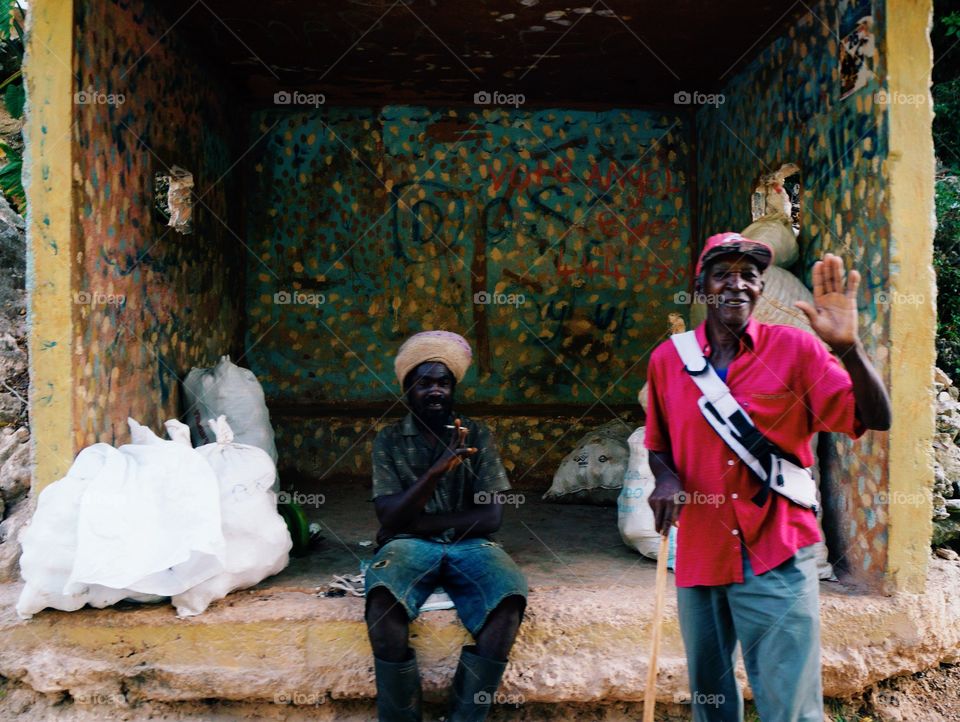 Two African man in front graffiti wall