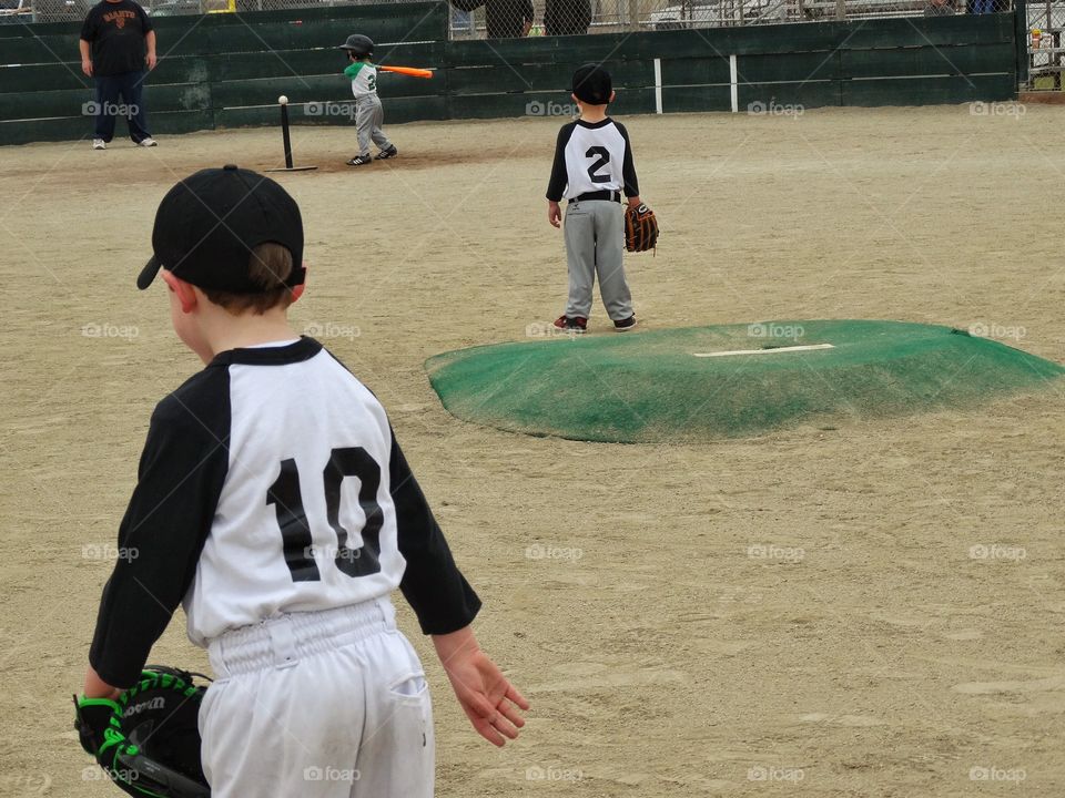 Young Baseball Players. Children Playing American Little League Baseball
