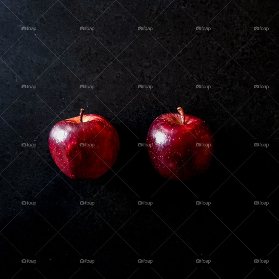 Red apple with black background