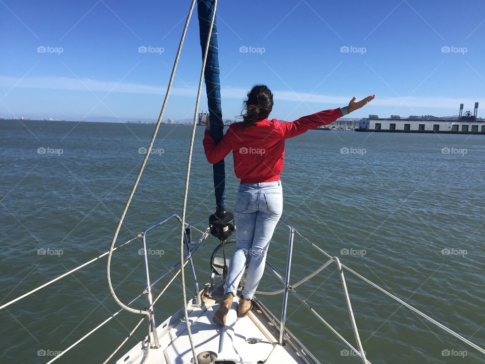 Female on a sailboat, SF Bay