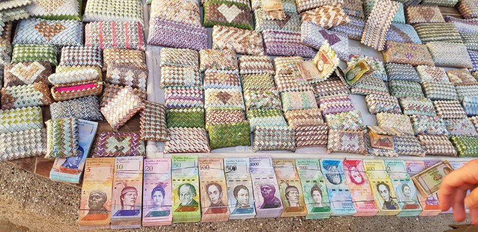 Wallets, bags and purses made from 100% real Venezuelan Bolívar money. Amazing to see the skill put into making these from people fleeing their country with nothing