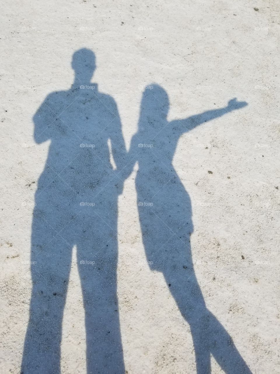 siholette man and woman in the salt lake in Sereflikochisar Turkey