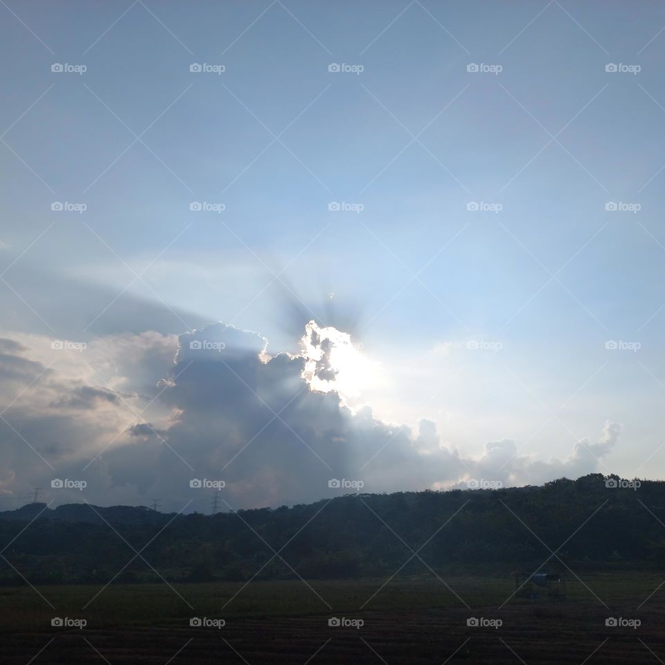 Afternoon in the fields when the sun is covered by clouds