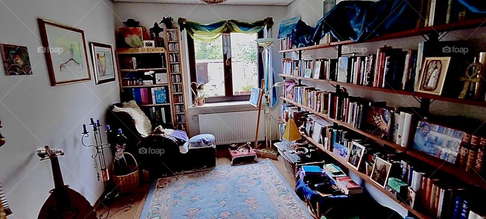 This room in the beautiful house in “Bavaria”, Germany is primarily used as an exercise room in the morning and as an art studio An easel for painting, paints, brushes and a work of art in progress are by the window. 2023. Hypnotic Productions