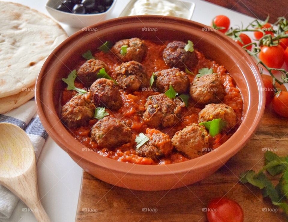 Meatballs in bowl on table