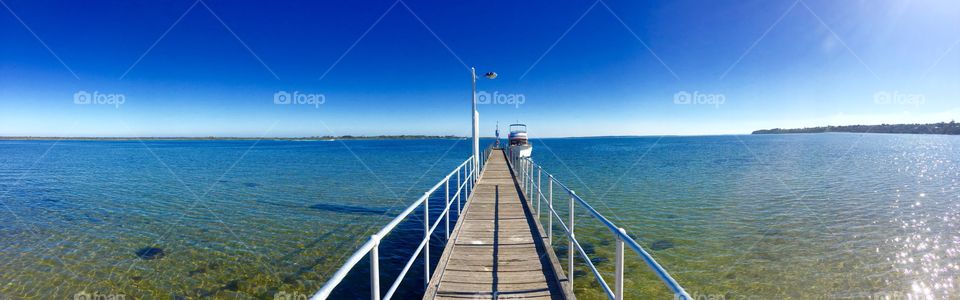 Walking along the Jetty to our boat
