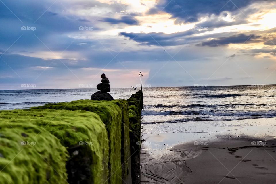 Breakwater on the North Sea beach. On a stormy day in the summer of 2019 on the island of Sylt