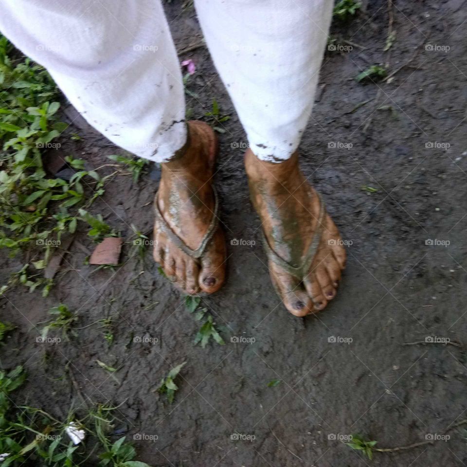My muddy feet, got this on a rainy day while walking down the rugged terrain to my ricefield