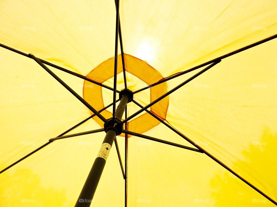 Yellow umbrella with spokes 