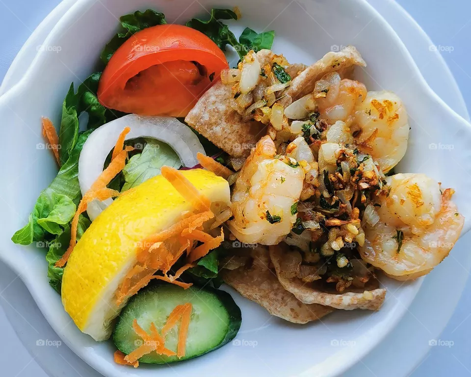 Garlic shrimp with vegetable salad.
