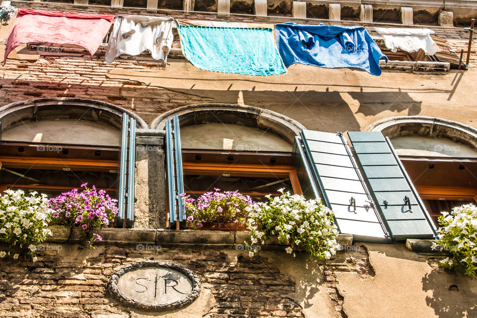 Windows And Hanging Laundry In Venice, Italy
