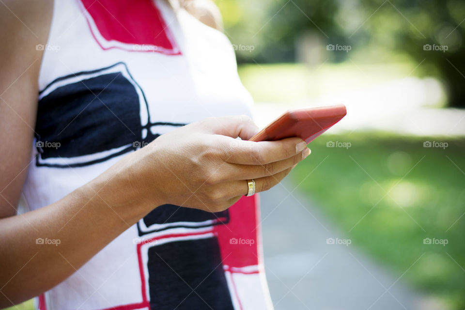 Close-up of woman using mobile phone