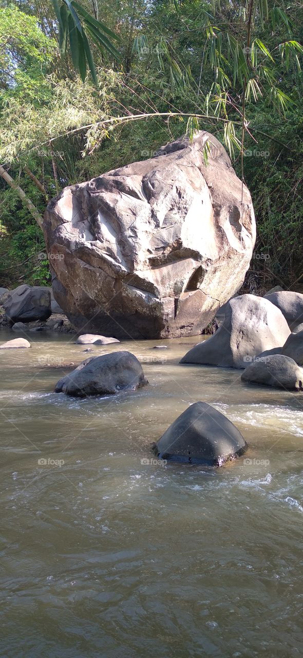 The big rock in the middle of the river