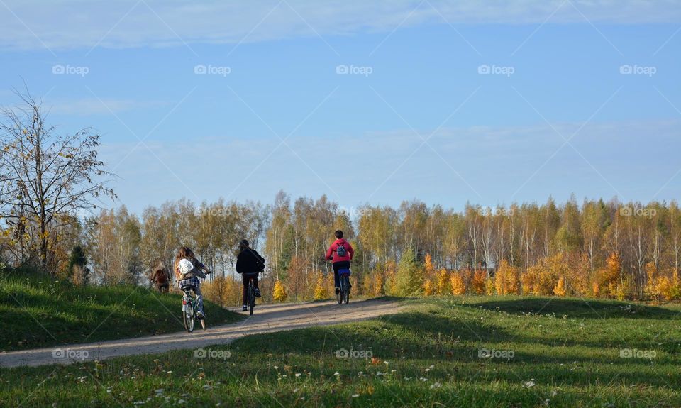 people riding bikes nature landscape