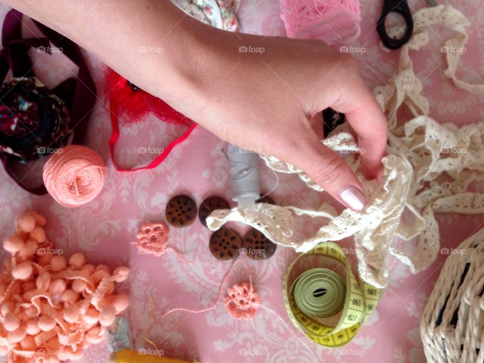 Women's hand takin a ribbon 