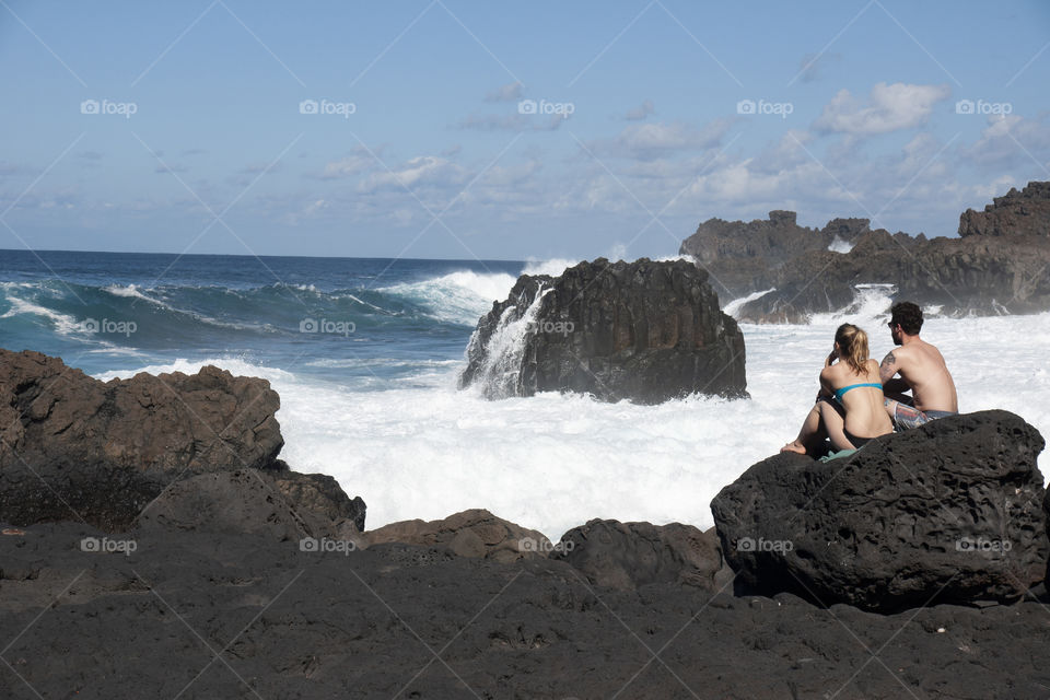 Couple looking at the waves