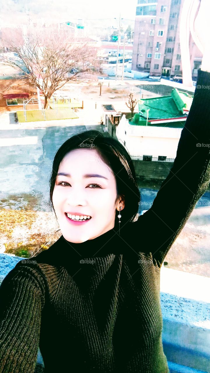 The View From the rooftop at the backside of our home where u can see One big Tree beside the commercial house and the houses and some buildings around it.
the sunlight of sunset give beautiful color to the whole places.