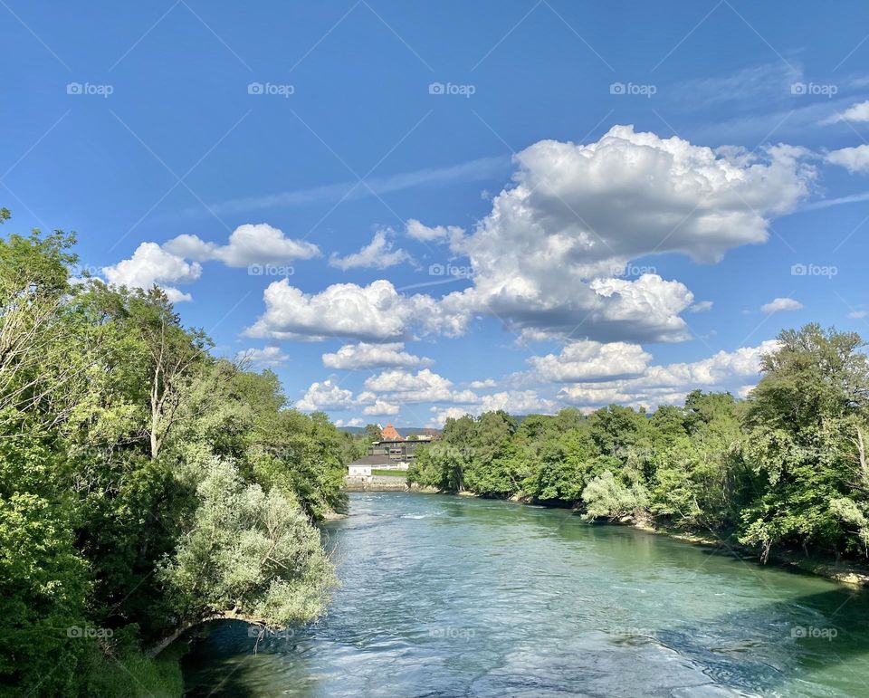 View from the bridge on the river and the cloudy sky