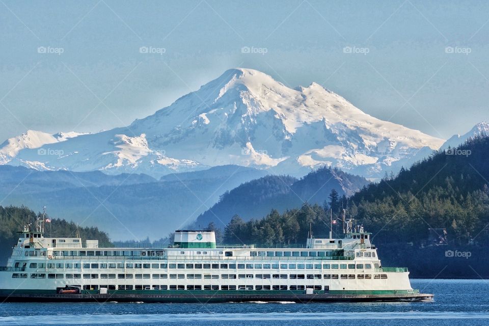 Anacortes, Washington State Ferry with Mt Baker in the background. The ferries travel to four of the San Juan Islands and to Vancouver Island, Canada. Anacortes is the gateway.