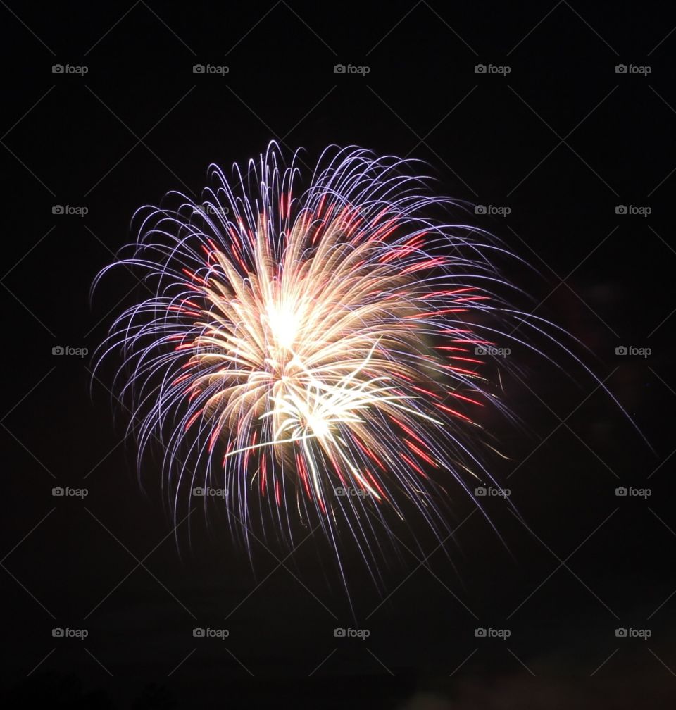 Purple, red and white firework blast