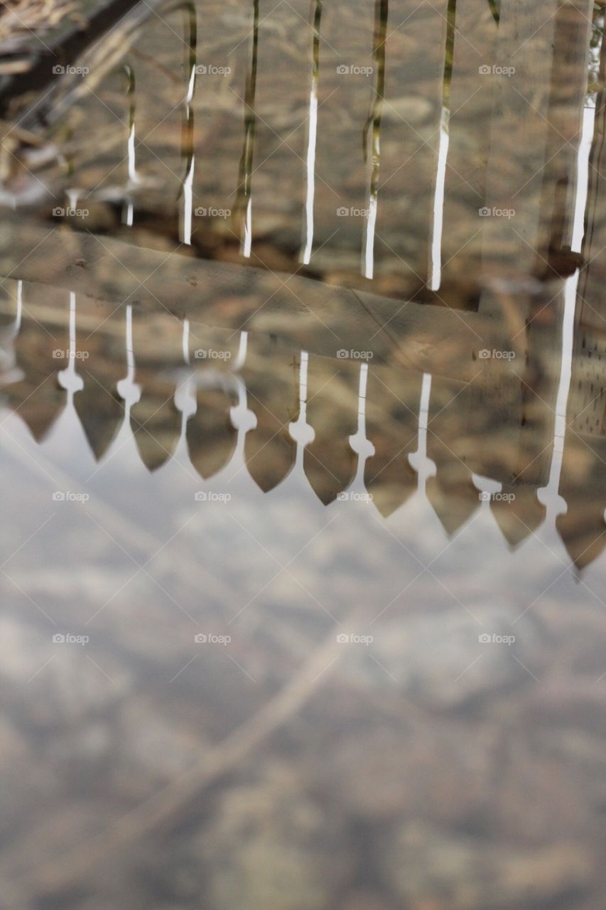 Fence reflecting in the rain