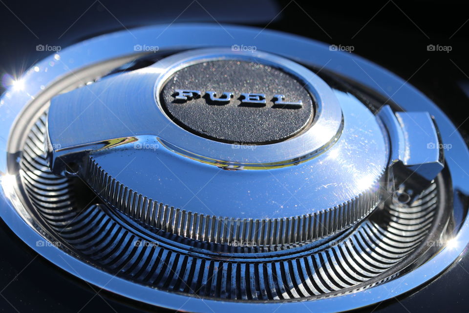 Chrome fuel cap on classic vintage car, closeup