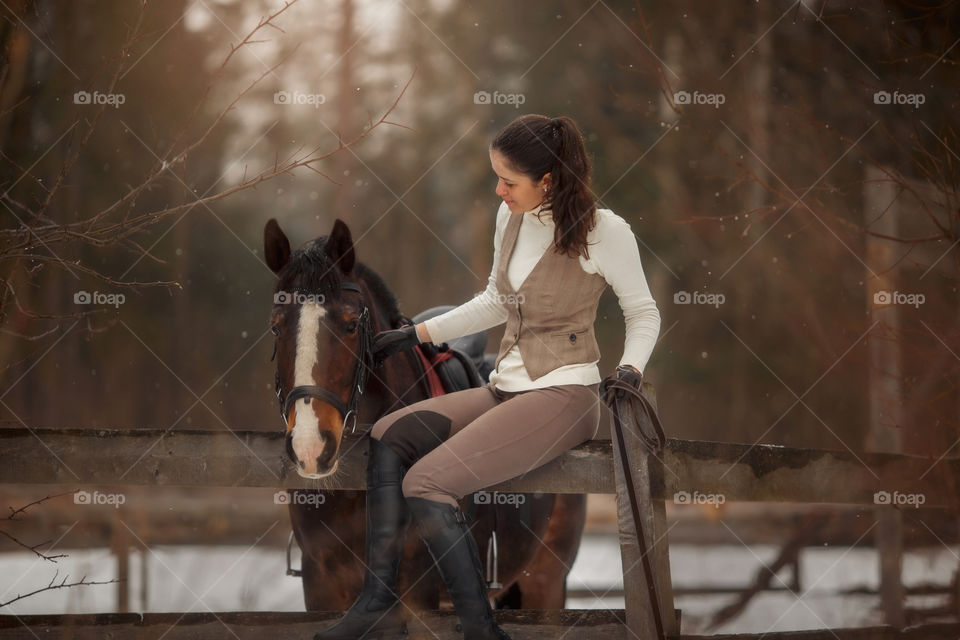 Young beautiful woman with horse outdoor portrait at spring day