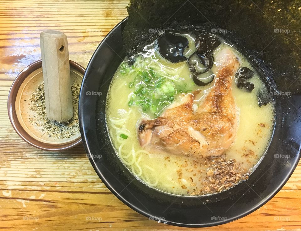 Chicken ramen with sesame seeds on the side