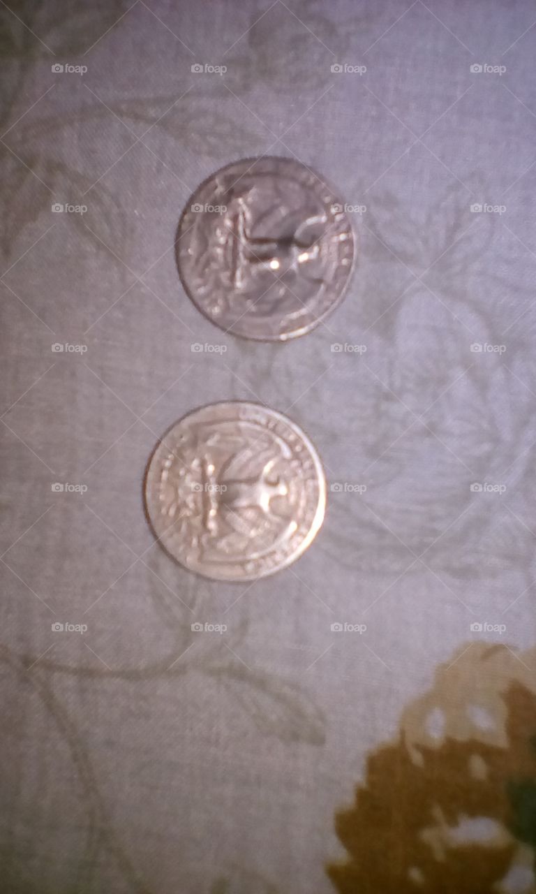 monedas de $0.25 USD.