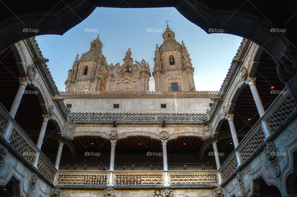 View of the building of Pontifical University of Salamanca from inside Casa de las Conchas, Salamanca, Spain.