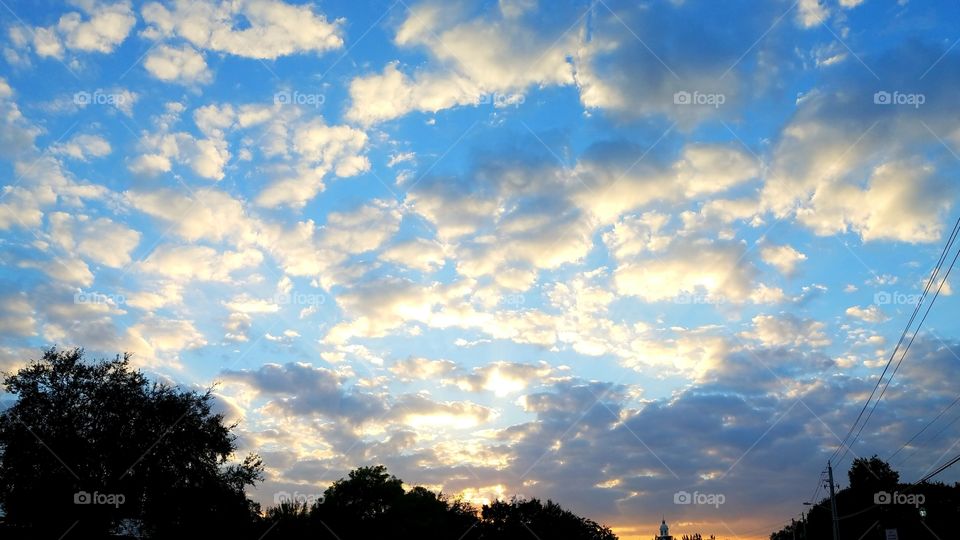 Gorgeous Sky - Clouds deftly cover the sky with splashes of white against the US sky.