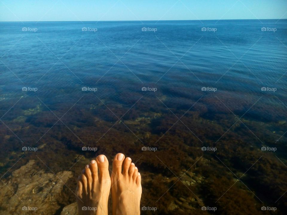 bare feet on a sea