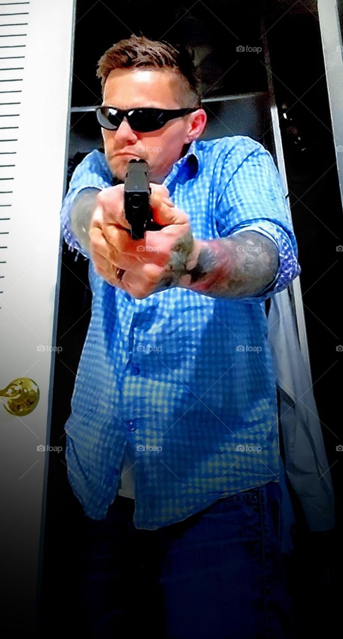 hot gunman
tattoo gun man
sexy man with gun
sexy man pointed gun
shoot at me
sexy man shooting gun